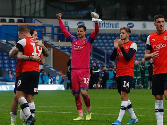 Simon Sluga celebrates Town's 2-1 win at Blackburn