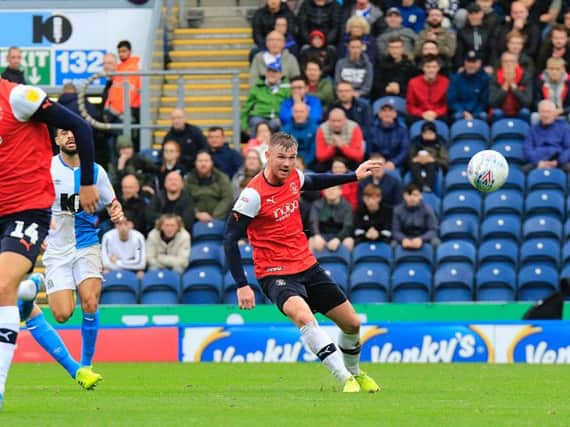 Ryan Tunnicliffe sends a pass out wide at Blackburn on Saturday
