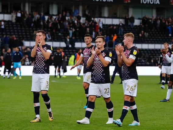 Town players applaud the visiting faithful after the 2-0 defeat at Derby
