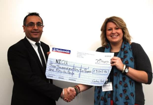 Harj Singh from Aldwyck presented the cheque to the L&D's Sarah Coulthard