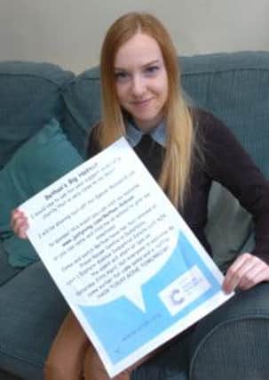 Barton teenager Bethan Robson with the poster advertising her Big Haircut