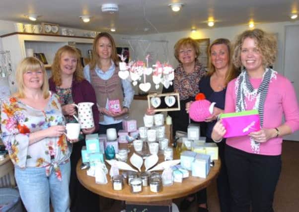 Kate Collins (right) with voluntary staff at Toddington's Little Shop on the Green