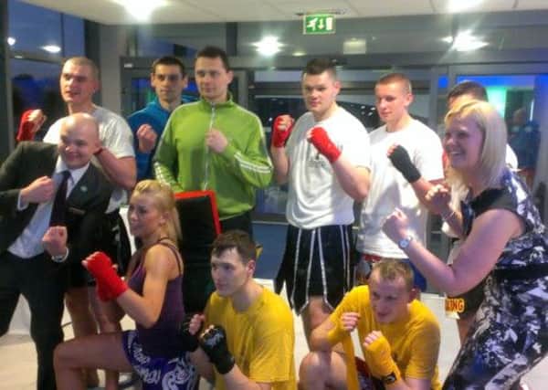 Magda Winska, front, second left, with friends from Warrior Fight Club and colleagues from Holiday Inn Express, Dunstable, after her kickbox challenge