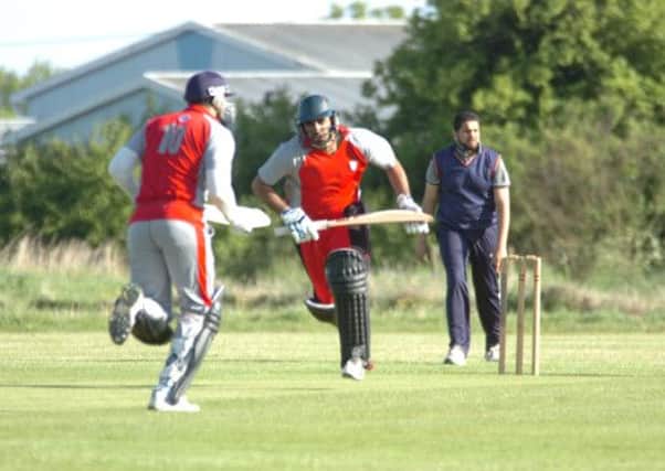 Action from Kingsway (in red) v Haidery Tigers