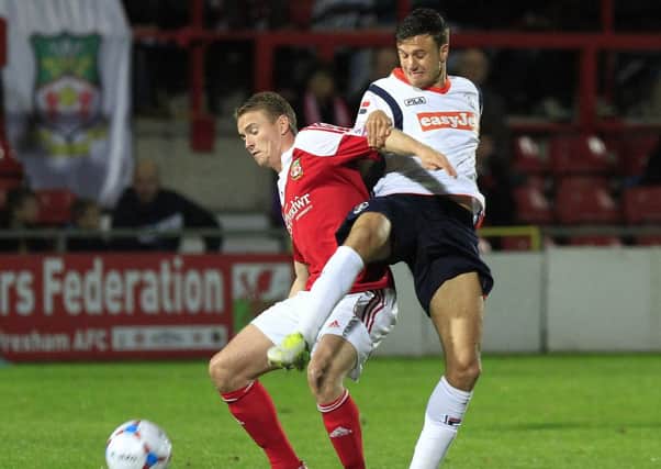 Jonathan Smith makes a challenge during the 2-0 defeat at Wrexham