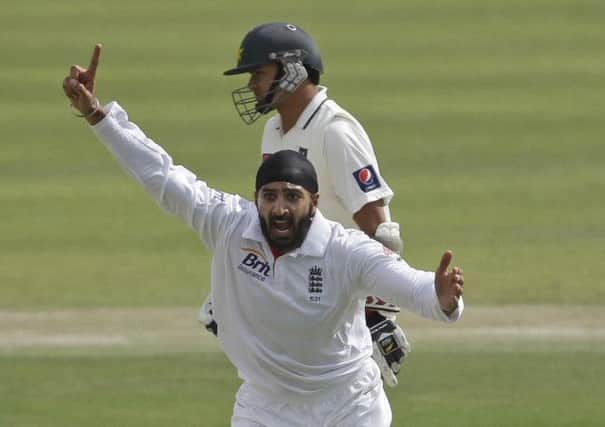 England's Monty Panesar celebrates taking the wicket of Pakistan's Mohammad Hafeez during the first day of the second cricket test match of a three match series between England and Pakistan Zayed Cricket Stadium in Abu Dhabi, United Arab Emirates, Wednesday, Jan. 25, 2012. (AP Photo/Hassan Ammar)