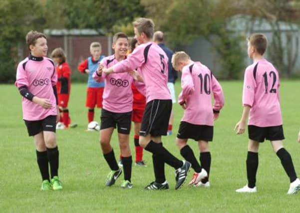 Bushmead Rovers U13s celebrate a goal on Saturday as they edged to a 6-4 victory over Mid Beds side Henlow Colts
