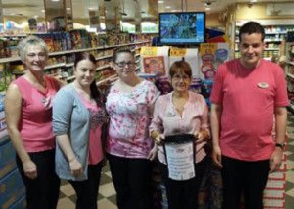 Team members at Nisa Local in Neptune Square, Houghton Regis, on the 'wear it pink' day