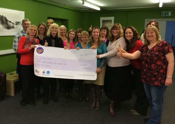 CHUMS staff with the ITV People's Millions cheque