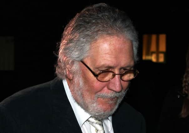 DJ Dave Lee Travis leaving Southwark Crown Court, London, where he is accused of a series of indecent assaults and one sexual assault. PRESS ASSOCIATION Photo. Picture date: Wednesday January 15, 2014. See PA story COURTS Travis. Photo credit should read: Sean Dempsey/PA Wire