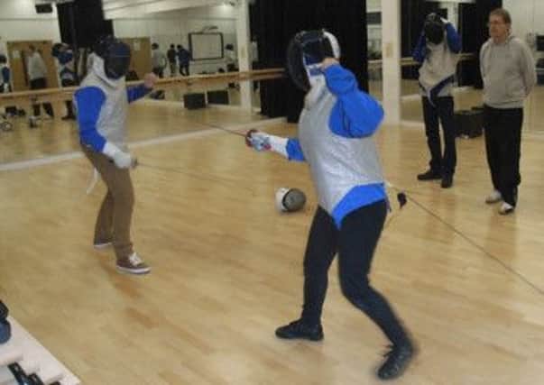 En garde: Bethany Hare, right, engaging Adnan Malik, left, during the first introduction to Luton Sixth Form College of the electric foil last week