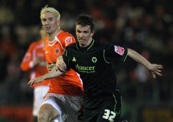 Blackpool's Shaun Barker challenges Wolves' Kevin Foley (right) during the Coca-Cola Championship match at Bloomfield Road, Blackpool. PRESS ASSOCIATION. Picture date: Monday December 29, 2008. Photo credit should read: Nick Potts/PA Wire. RESTRICTIONS: Use subject to restrictions. Editorial print use only except with prior written approval. New media use requires licence from Football DataCo Ltd. Call +44 (0)1158 447447 or see www.paphotos.com/info/ for full restrictions and further information. B21849611230590072A