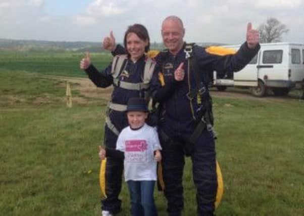Six-year-old Rhys Kiernan with his godmother Mikala and her partner Alistair who did a skydive to raise money for his charity