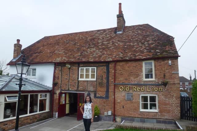 Cathy Price outside the Red Lion Pub in Houghton Regis