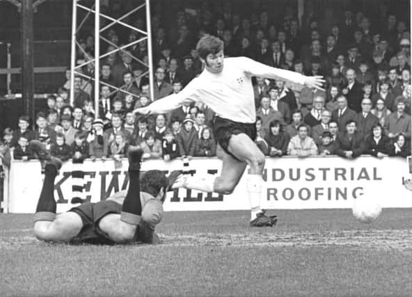 Malcolm Macdonald scores for Luton Town.