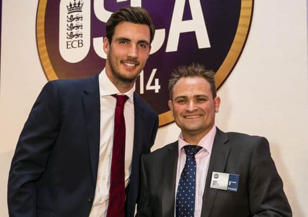 Andy Watts with England bowler Steven Finn