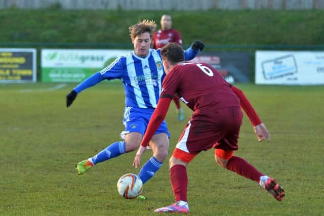 Charlie Henry in action for Dunstable against Paulton