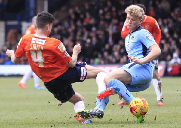Jonathan Smith and Cameron McGeehan get stuck in on Saturday