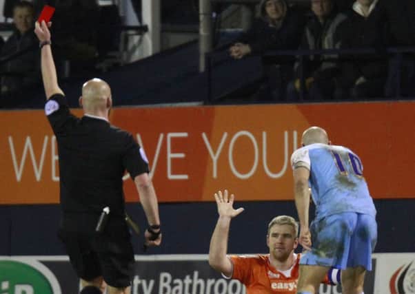 Steve McNulty is shown a straight red card