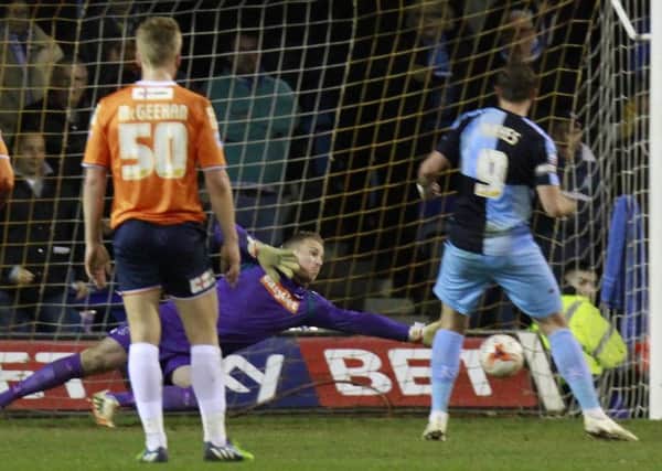 Elliot Justham is beaten from the spot for Wycombe's second