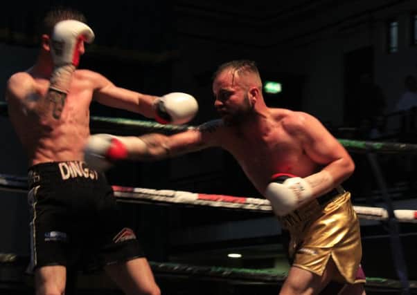 Michael Devine in action against Adam Dingsdale