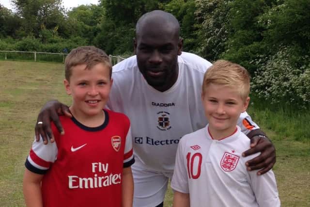 Enoch Showunmi meets two youngsters