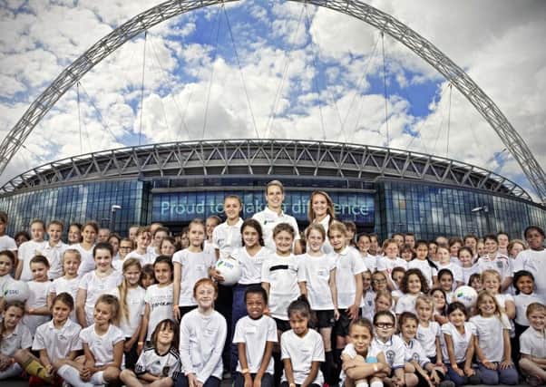 Star turn: Schoolchildren meet ex-England international Rachel Brown-Finnis