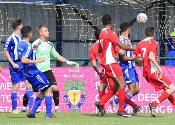 Dunstable Town's Ollie Coles finds the net