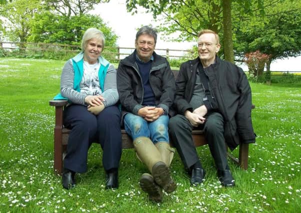Celebrity gardener Alan Titchmarsh in the Keech Hospice Care garden with Suzanne and George Thomas, who has since died