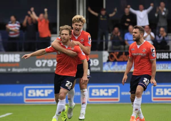 Craig Mackail-Smith celebrates his leveller from the penalty spot