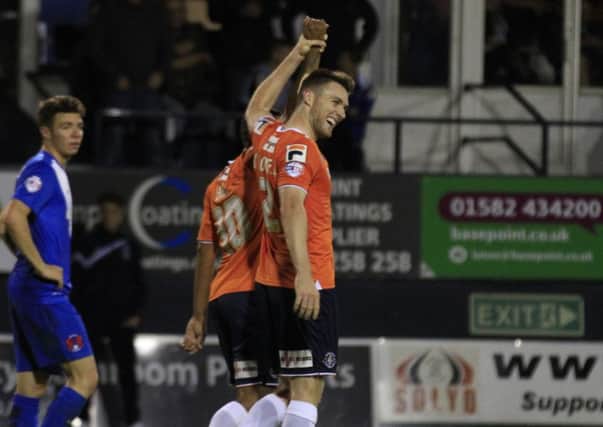 Whose goal was it? Stephen O'Donnell raises Ryan Hall's hand after Town's late winner