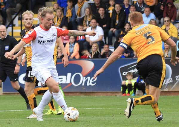 Danny Green is about to score Luton's third at Cambridge