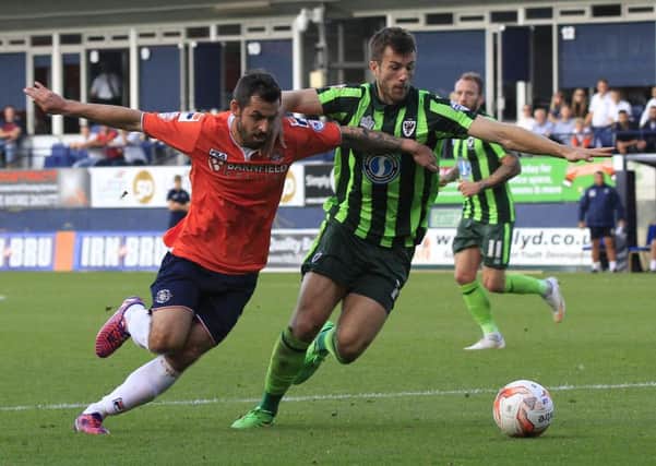 Alex Lawless came off the bench to help Hatters beat AFC Wimbledon