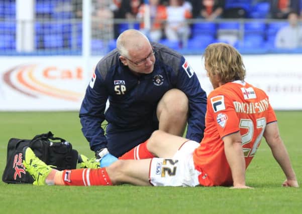 Craig Mackail-Smith receives treatment from physio Simon Parsell