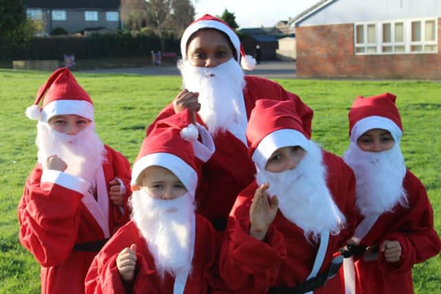 Little learners limber up for Keech Hospice Care's annual Santa fun run