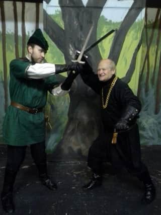 Robin Hood (Iain Grant) battling with the evil Sheriff of Nottingham