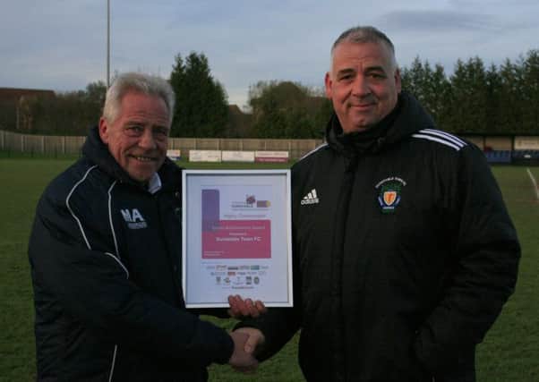 Dunstable Town chairman John McLoughlin receives a Sports Achievement sponsored by HQ Sports bar