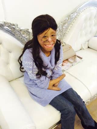 Shamiam Arif in the wig from The Little Princess Trust