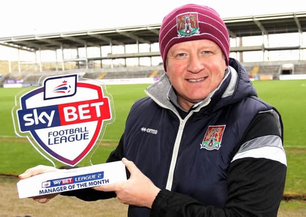 Chris Wilder with his League Two manager of the month trophy