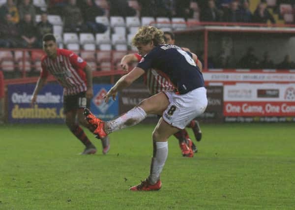 Cameron McGeehan scores from the spot against Exeter