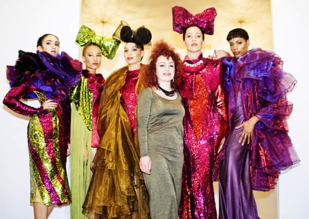 Designer Helen Woollams with her models [picture: Mary Germanou]