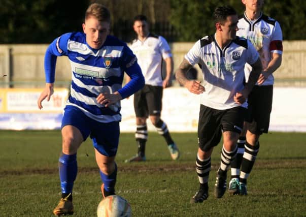 Adam Watkins in action against Cambridge City