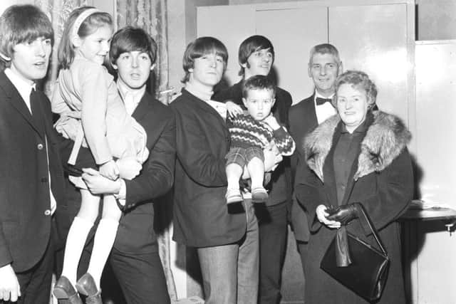The Beatles at The Ritz with the Mayor & Mayoress of Luton, holding two year old Stephen Atkinson and six year old Susan Elson, Nov 4, 1964. ENGPNL00120110402111856