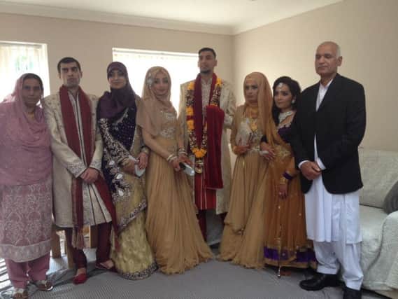Mohammed Majid Malik (centre) pictured with his family on his wedding day