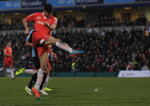 Jonathan Smith volleys in the equaliser at Wycombe last season