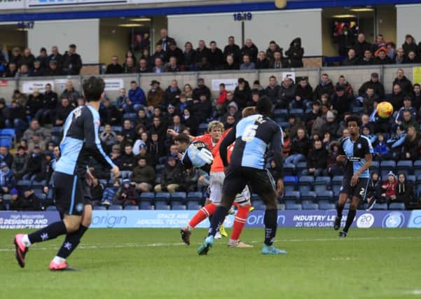 Cameron McGeehan scores the opening goal at Wycombe