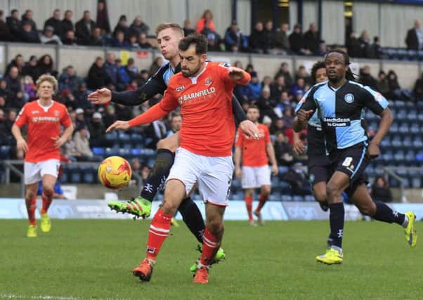 Alex Lawless shields the ball at Wycombe on Saturday
