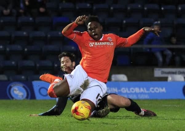 Pelly Ruddock Mpanzu is brought down against Wycombe on Saturday