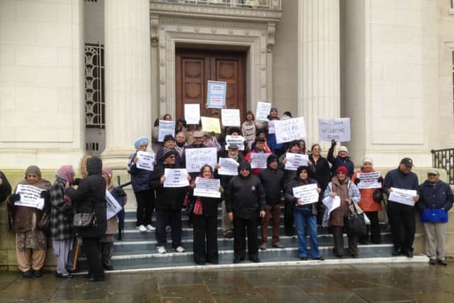 Members from the wellbeing groups protested outside the Town Hall