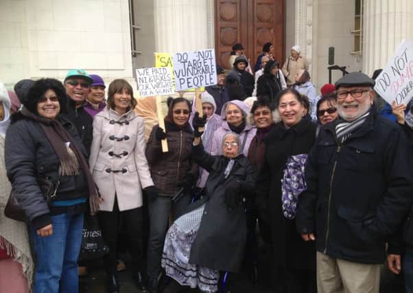 Members of the Wellbeing groups for older Asian people protesting outside the Town Hall